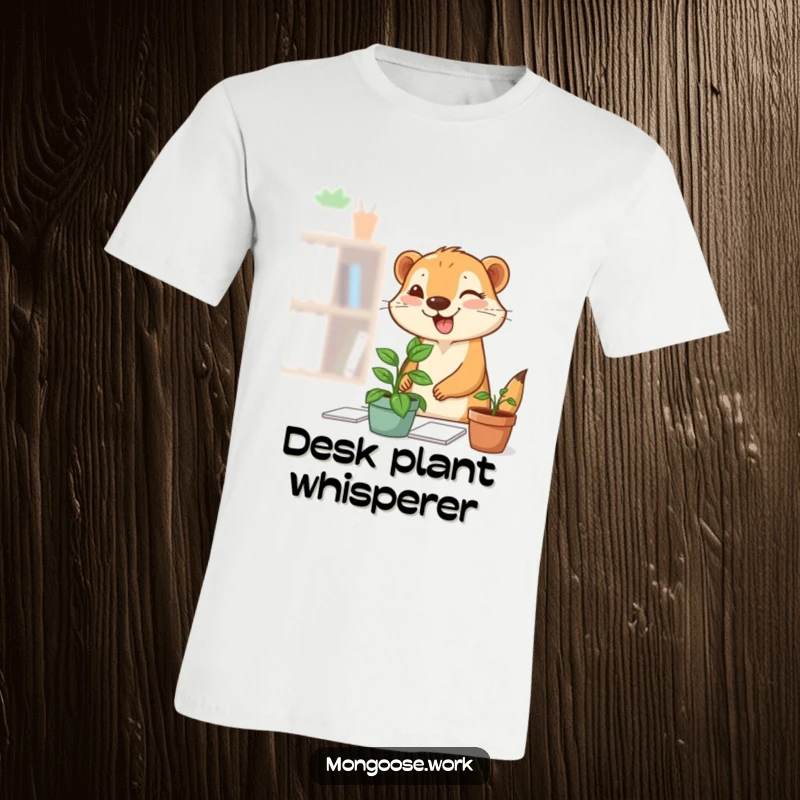Funny Mongoose Plant T-Shirt: A small mongoose is shown happily adding a potted plant to a desk, complete with a mischievous wink.